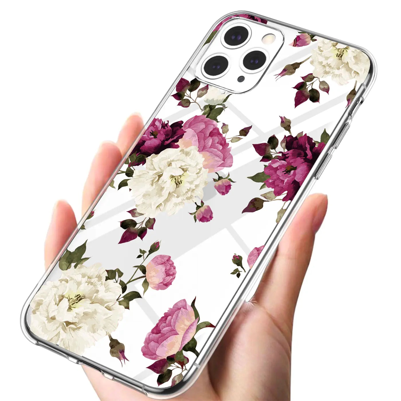 Hand hält transparente TPU-Hülle für iPhone 12 Pro Max mit weißem und pink-violettem Blumendruck, schräg von oben.