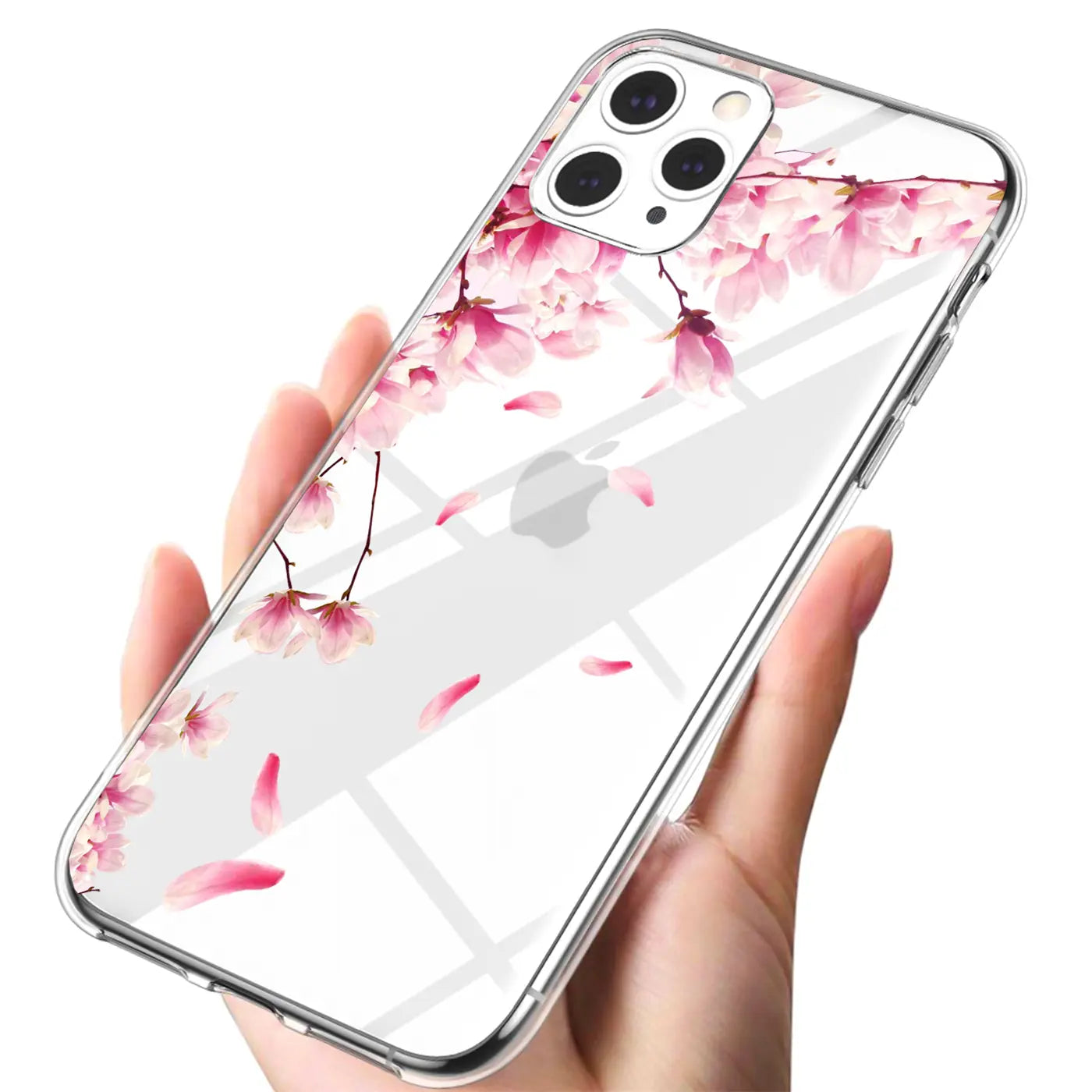 Hand hält transparentes iPhone 12 Pro Max TPU-Case mit rosa Kirschblüten-Motivdruck, schräg von oben.