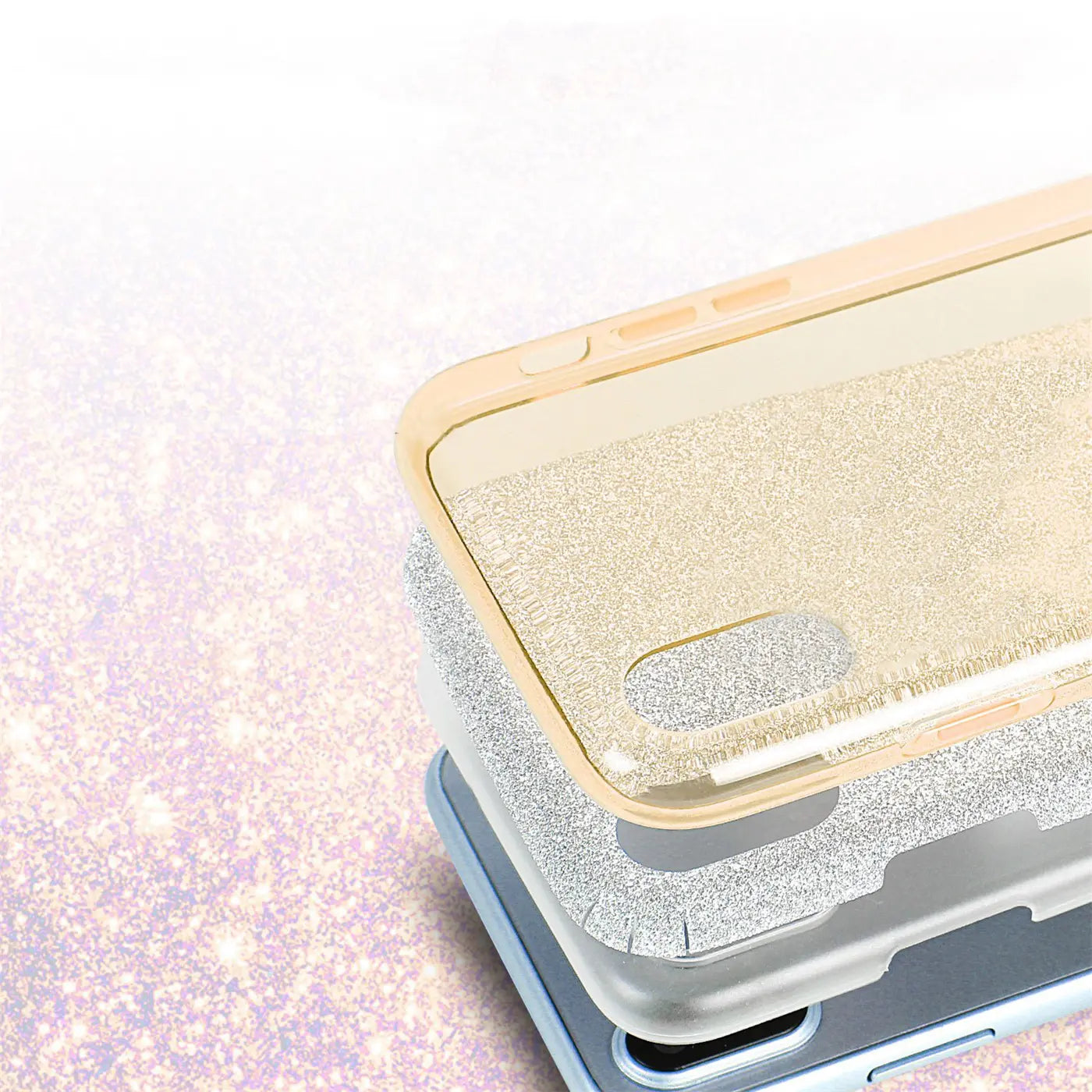 Drei iPhone X/XS Hüllen in Gold, Silber, Blau, TPU, Glitzer, von oben gezeigt.