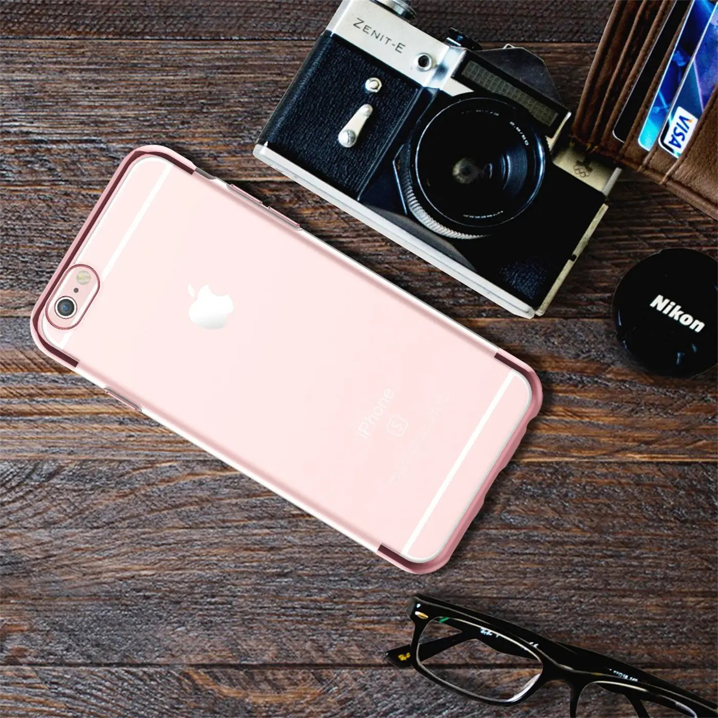 iPhone 6/6S in transparenter Hülle mit rosa Rand, von oben, auf Holz