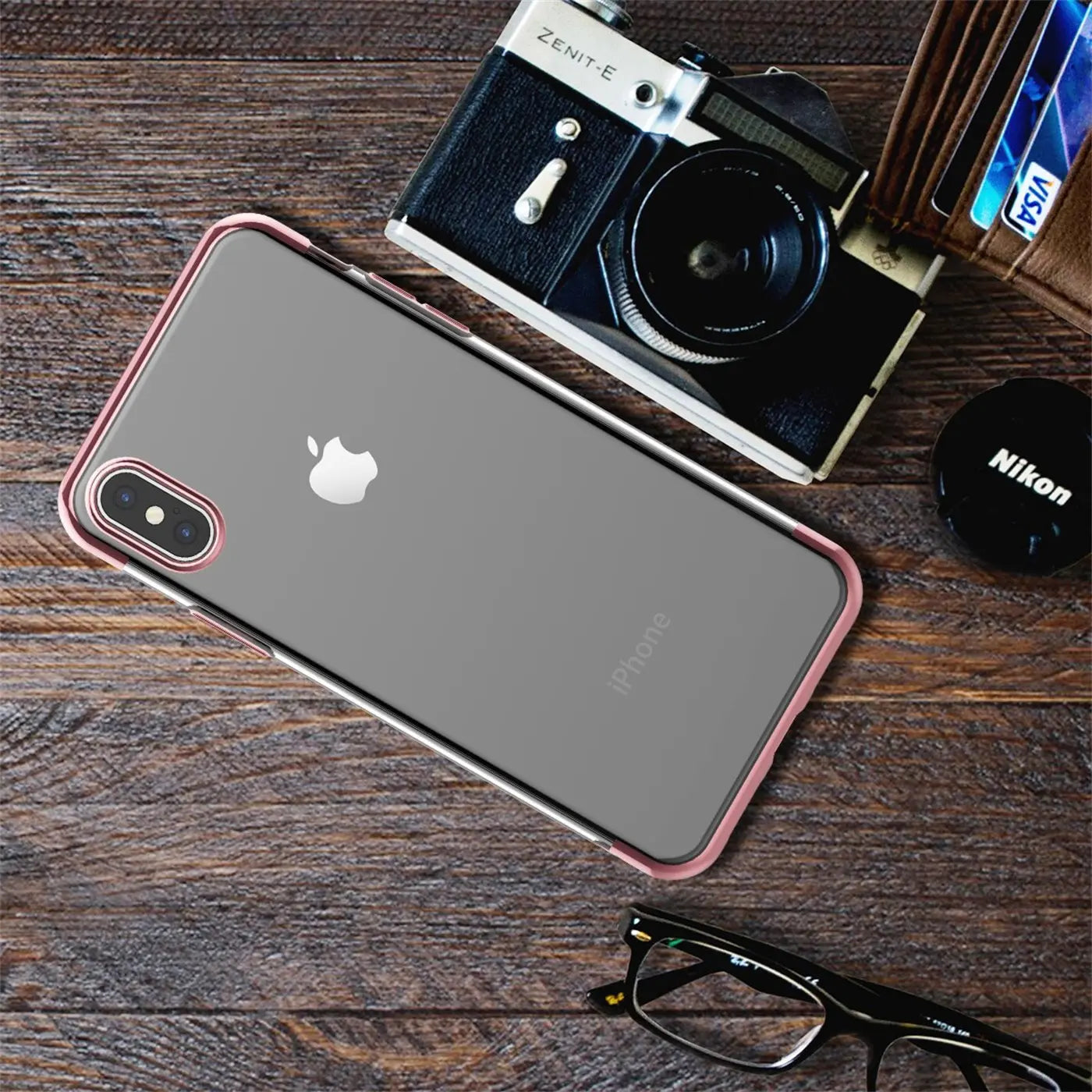 iPhone Xs Max mit transparenter Hülle und roségoldenem Rand, von oben fotografiert.