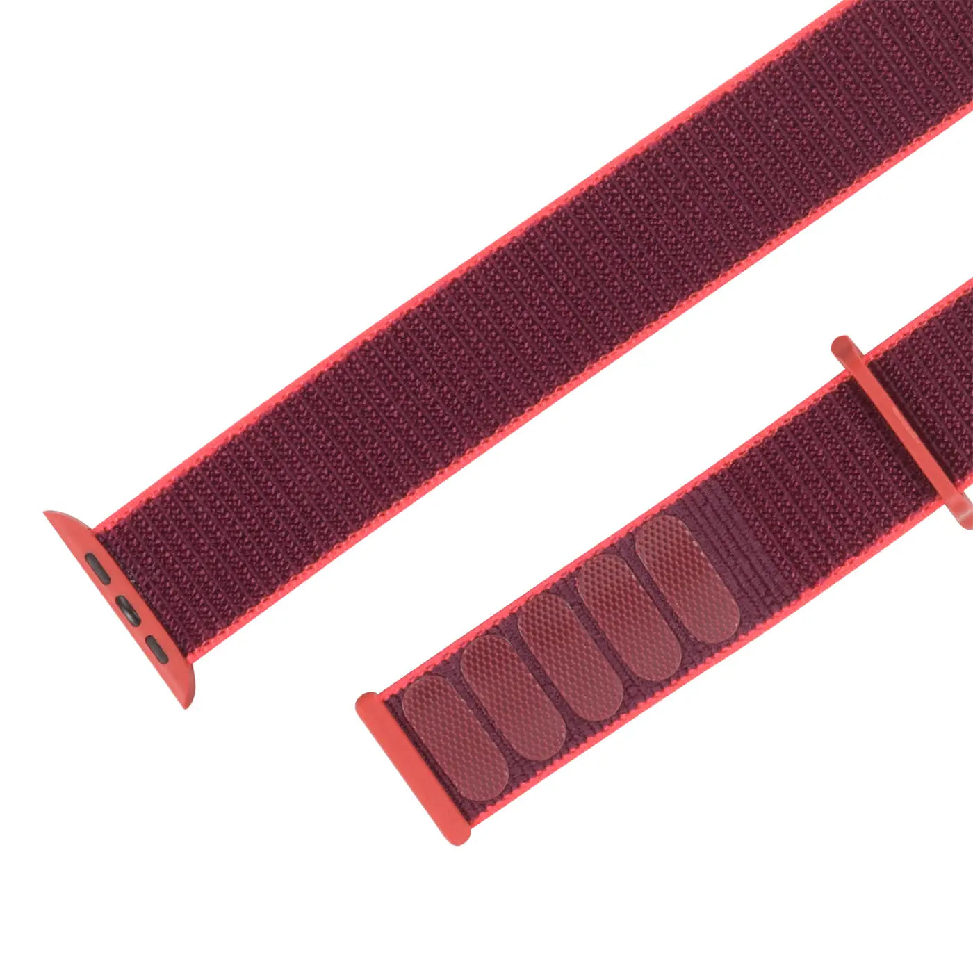 Rotes Nylon-Fitnessarmband für Apple Watch, schräg von oben. Mit Klettverschluss und Adaptern.